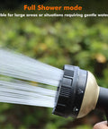 Close-up of heavy duty metal hose nozzle with 8 spray patterns in full shower mode, bronze finish, for gentle watering