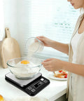 Woman baking using Waterproof Pro Grade Digital Kitchen Scale With IP67 Rating 10Kg Capacity 0.1g Precision Type C Rechargeable 304 Stainless Steel Platform