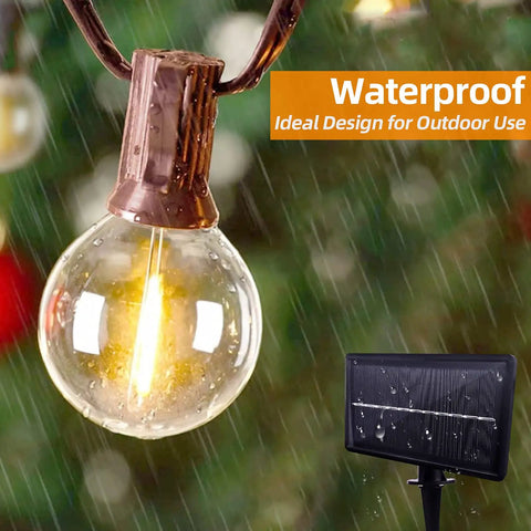 G40 Solar String Lights Outdoor 32Ft With 20 Plus 2 Shatterproof Edison Bulbs in rain showcasing IP65 waterproof feature