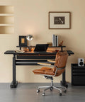 Super Sturdy Electric Standing Desk With Dual Storage Drawers And Whisper Quiet Lift Features A Heavy Duty Ash Wood Desktop In Crisp Matte Black, shown with a stylish office chair and accessories.