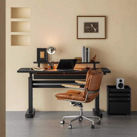 Super Sturdy Electric Standing Desk With Dual Storage Drawers And Whisper Quiet Lift Features A Heavy Duty Ash Wood Desktop In Crisp Matte Black, shown with a stylish office chair and accessories.