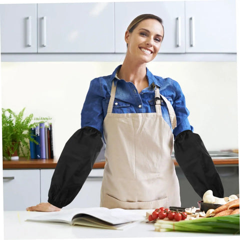 Woman in kitchen wearing 2 Pack Genuine Oilproof Arm Sleeves Kick Grease To The Curb During Kitchen Grinds Or Yard Work.
