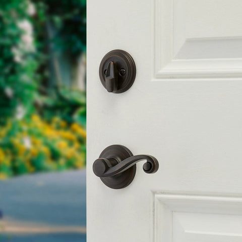 Shelburne Single Cylinder Handleset With Lido Lever And SmartKey In Venetian Bronze for exterior keyed entry on white door