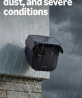 Outdoor security camera in rain demonstrating weather resistance and durability, mounted on wall, suitable for harsh conditions.