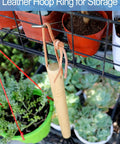 15 Inch Garden Claw Rake with leather hoop ring for storage hanging on garden rack near plants