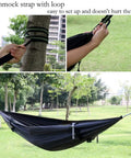 Ultra Lightweight Camping Hammock With Mosquito Net And Rainfly A Backpacker Ready Portable Sleeping Hammock Tent For Trail Trips And Outdoor Adventures Orange straps set up on trees