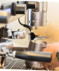 Barista using coffee machine with Steam Pipe Rubber Sleeve Replacement Kit For Old Parts No Sweat Install, DIY Home And Outdoor Insulation Solution, Hot Water Line Sleeve, Lightweight Portable And Simple To Fit for efficient steam handling.
