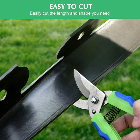 Cutting flexible black plastic of 2 Inch Landscape Edging Border Kit With 100 Anchoring Spikes, scissors trimming edge for gardens