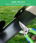 Cutting flexible plastic edging from 2 Inch By 100 Foot Landscape Edging Border With 150 Spikes, No Dig Garden Kit for curves.