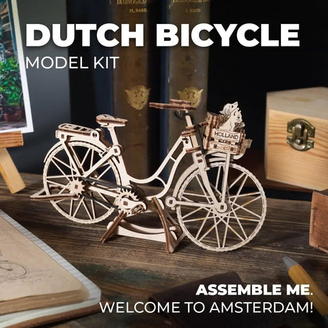 Hands On Dutch Bicycle 3D Puzzle Model With Rear Rack And Front Basket Amsterdam Themed Mechanical Toy For Brain Teaser Fans Includes Tiny Cat Dog And Flower Figures For The Basket. wooden bike model kit on stand, front view