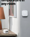 Slick Indoor Air Quality Monitor Tracks Temp Humidity Carbon Monoxide Pm2.5 Vocs Hooks Into Alexa Sends Snappy Alerts To Keep Your Home Breezy And Pretty Much Fume Free on a wooden table.