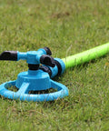 Automatic Lawn Sprinkler For Large Yards, ABS Plastic Rotary Sprinkler With Three Arm Design on grass