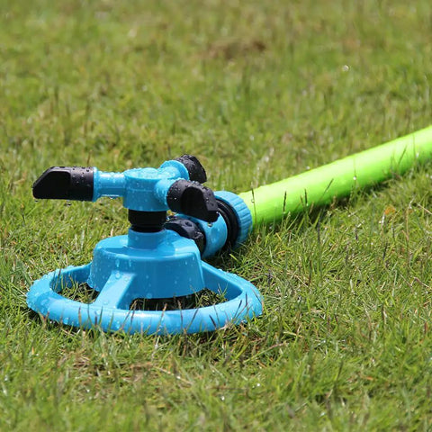 Automatic Lawn Sprinkler For Large Yards, ABS Plastic Rotary Sprinkler With Three Arm Design on grass