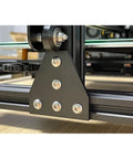 Close-up of five-hole 90-degree joint board plate connectors corner angles brackets for aluminum plate hardware accessories.