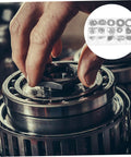 Hand using 175 Piece Steel Snap Ring Kit C Type Retaining Ring Clips Set for Shafts and Bearings, Circlip Assortment, machinery repair