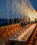 Outdoor dining setup with Extra Long 181 Foot 500 LED Christmas String Lights Indoor Outdoor With Clear Wire Warm White 8 Modes Plug In Fairy Lights
