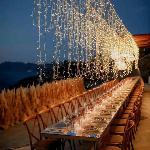 Outdoor dining setup with Extra Long 181 Foot 500 LED Christmas String Lights Indoor Outdoor With Clear Wire Warm White 8 Modes Plug In Fairy Lights