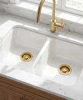 Golden Stainless Steel Garbage Disposal Flange And Sink Stopper For Three And One Half Inch Drain Hole on white sink