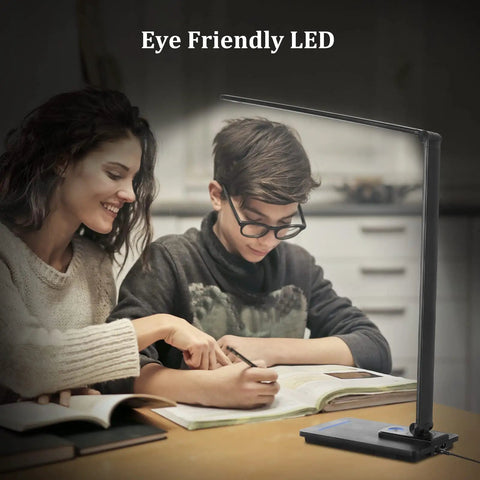 Two people studying under Go-To Smart Desk Lamp With 10W Wireless Charger And USB Port For Home Office, Eye Friendly LED