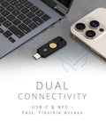 Zero Drama Dual Mode Usb C Security Key With Nfc Tap Feature For Seamless Passwordless Login Supports Fido2 Protocols And Modern Passkeys Across Every Device You Own Keychain Ready next to a laptop and smartphone.