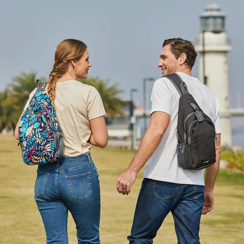Two people walking outside, each wearing an RFID Blocking Sling Bag Crossbody Backpack For Hiking And Travel, Lightweight Daypack With Hidden RFID Pocket And 3 Main Compartments, Durable Water Resistant Material, Easy Access Pockets For Cards, Phone, And Passport