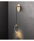 Premium Copper Wall Sconce Featuring Sparkling Crystal Accent Shades With Soothing Warm Led Glow For Contemporary Bedroom And Corridor Spaces, hanging design with black cord.