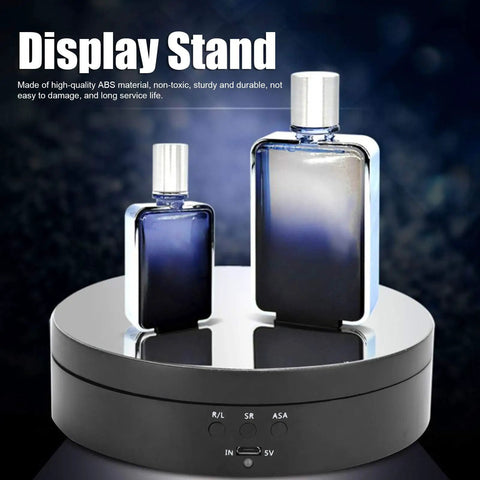 Spiffy Omquot Electric Rotating Jewelry Stand With 360 Degree Swivel Plate And Usb Charging Port For Watches Cosmetics And Toys In Sleek Black Finish showcasing two perfume bottles on a mirror-like surface.