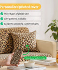 Living room with leopard print personalized cover on sofa, cushion, and phone case; plant and books in background