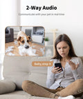 Woman using Indoor Pet Camera With Treat Dispenser And Remote Toss 360 Degree View 5G And 2 4G WiFi Two Way Talk with dog