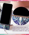 Image of a mandala-designed phone stand with a phone, from 4 Pack Large Mandala Diamond Painting Phone Stand Kit 5.5 Inch DIY Full Drill Crystal Diamond Art Phone Holder Bling Craft Set For Beginners And Adults Creative Home Phone Accessory.
