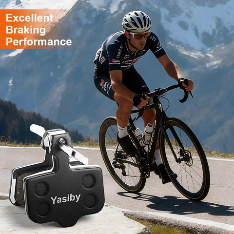 High-Performance Disc Brake Pads for Mountain Biking with cyclist descending mountain road.