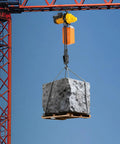 Heavy Duty 2200 Lbs Electric Chain Hoist With Single Phase Power Pulling Loads High Up To 10 Feet lifting a stone block.