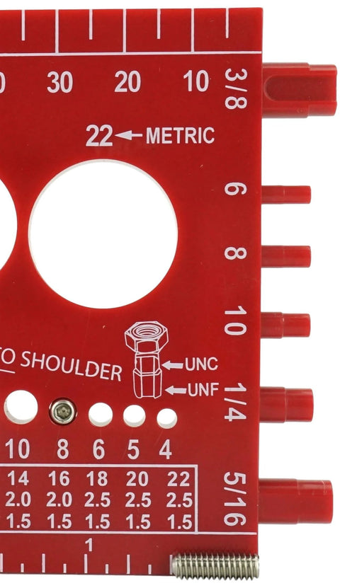 Red metric and imperial bolt gauge with measurement markings and holes for size testing.