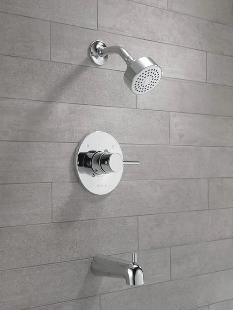Modern Single-Handle Chrome Tub And Shower Trim Kit And With Single-Spray Touch-Clean Shower Head Valve Not Included Rough-In Sold Separately Durable Shower Fixture on tiled wall