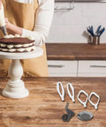 Baker using Cookie Paddles With Whip Drive For Stand Mixers, Includes 2 Cake Paddles, 2 Cookie Paddles, 1 Dough Hook Extender, And 1 Metal Whip Drive, Pro Grade Versatile Baking Attachments Set, on a cake.