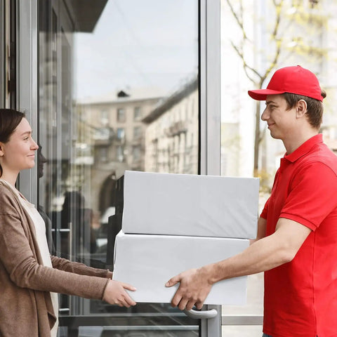 Delivery person handing over boxes representing Heavy Duty 19x24 Inch Poly Mailers 500 Pack Bulk Shipping Envelopes for Clothes Self Seal White Plastic Mailing Bags for E Commerce Packaging and Small Biz.