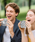 Couple enjoying burgers wrapped in Pre Cut Insulated Foil Sandwich Wrap Sheets Grease Resistant For Hot Food 10.5 By 14 Inches 100 Pack