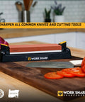 Pro Grade Kickass Benchtop Whetstone Knife Sharpener With 1000/6000 Grit Corundum Stones on a kitchen counter with knife and vegetables