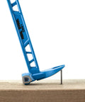 10 Inch Double Ended Nail Puller Cats Paw Pry Bar in blue forged carbon steel pulling a nail from wood