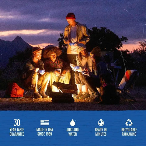 Group of campers enjoying Freeze Dried Rice And Chicken With Carrots Celery And Red Peppers Emergency Canned Meal Pack by campfire