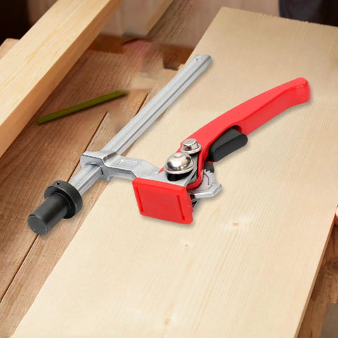 Rugged Woodworking Clamp For Workbench Dog Hole And Versatile Table Vise with red handle in use, ideal for 16mm DIY projects.