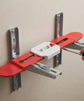 Telescopic Spirit Level for Air Conditioner Indoor Unit Installation mounted on wall with adjustable brackets and bubble level.