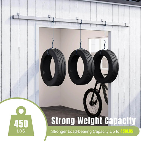 Exterior Sliding Barn Door Hardware Kit With Box Rail Track Supports Up To 450 Pound Capacity installed on wall with hanging tires