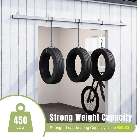 Exterior Sliding Barn Door Hardware Kit With Box Rail Track 450Lb Capacity shown outdoor holding tires