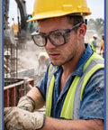 Slick Anti Fog Safety Glasses With Built In Side Shields, ANSI Z87.1 Certified, worn by a worker in a hard hat and gloves.