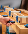 4 Inch Mini F Style Woodworking Clamps Pack Of 4 Beefy Heavy Duty Small Bar Clamps with Sure Foot Base in use on workbench