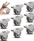 Top Notch 1.5 Inch Fixed Caster Wheels Smooth Operator Rubber Tpr Design For Furniture Drawers And Storage Bins Floor Loving Kickback Free Quiet Ride Silver Pack Of 8 displayed in a hand with shiny silver metal bases.