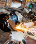 Heavy Duty Double Sander Benchtop Grinder With 500 Watt Motor in use, showing sparks while grinding metal on a workbench.