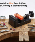 Compact Mini Bench Vise Featuring Smooth Parallel Jaw Clamping For Precision Watch Repair Sculpture Diy Carving And Home Shop Projects Built Different Heavy Duty on wooden workbench with jewelry items.