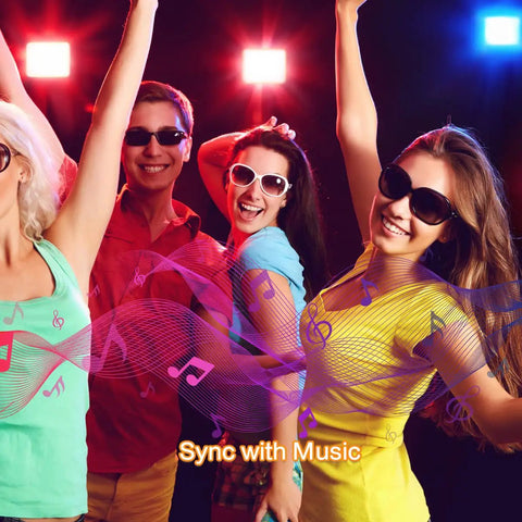 People dancing under Outdoor LED Flood Lights Lit RGB Color Changing Smart Landscape Lights With 16 Million Colors.